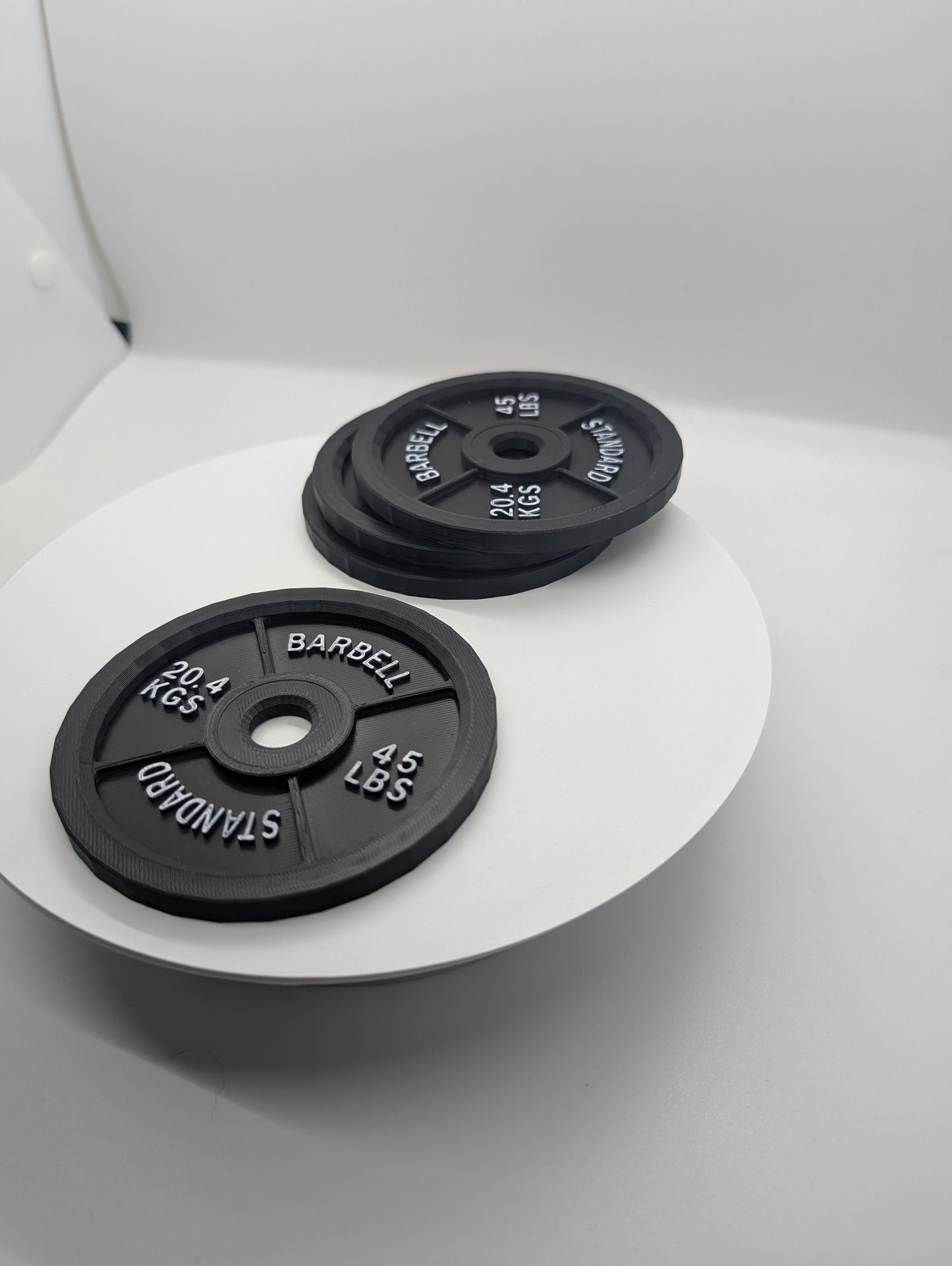 Barbell Coaster set of 4 drink coasters. Perfect for gym office.