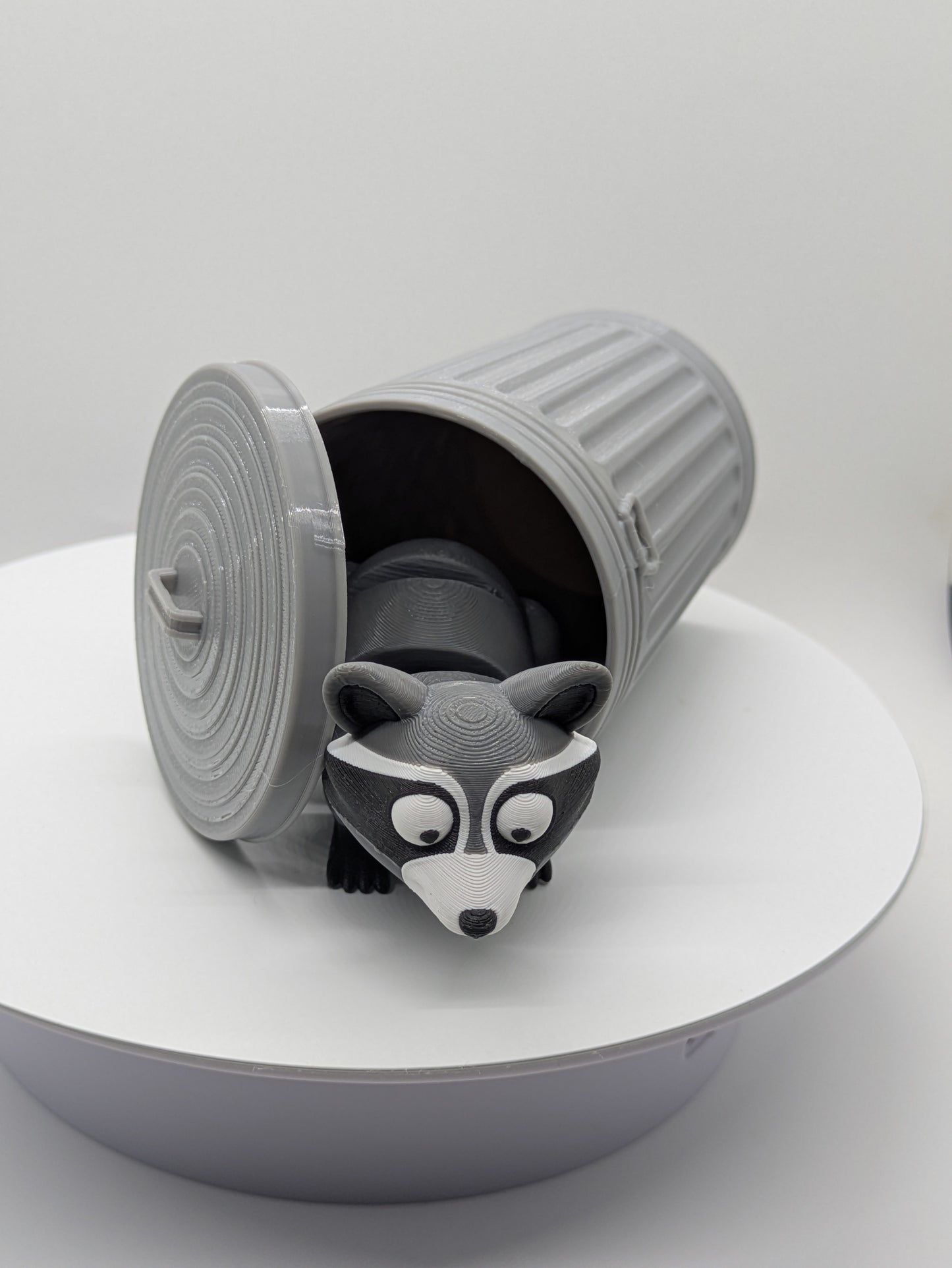 Raccoon in trash can Trash Panda