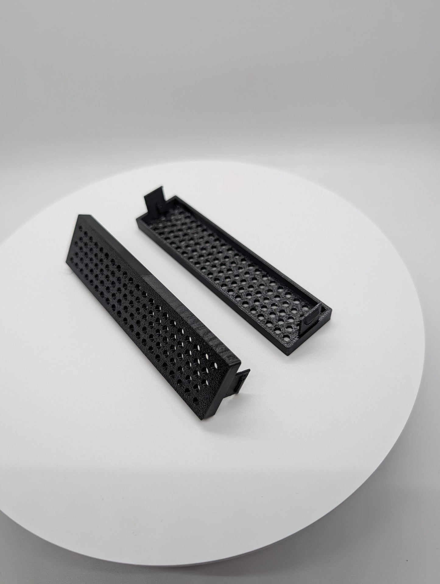 2x - 3.5 inch disk drive bay cover holes - circles . black replacement computer tower parts.